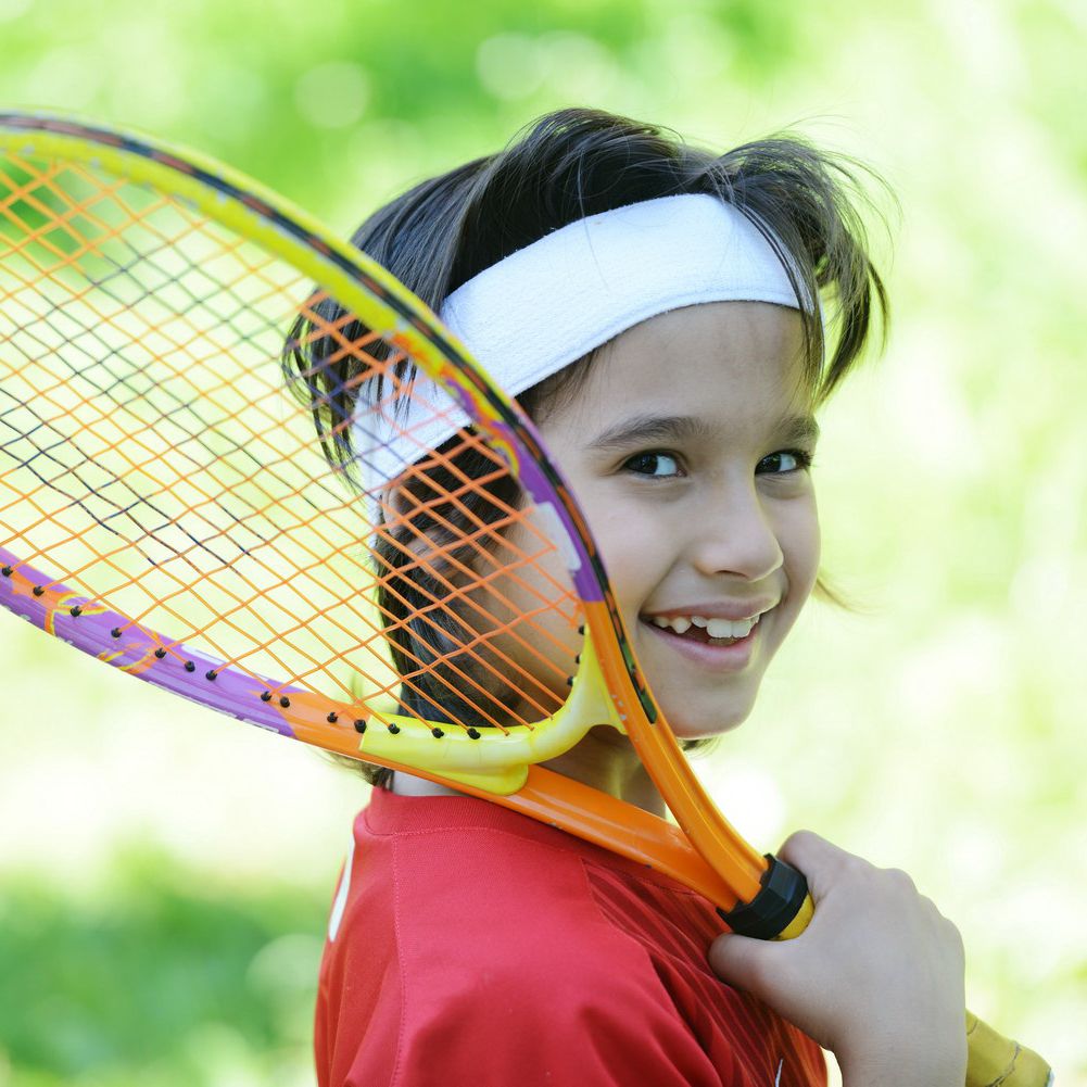 Child playing tennis